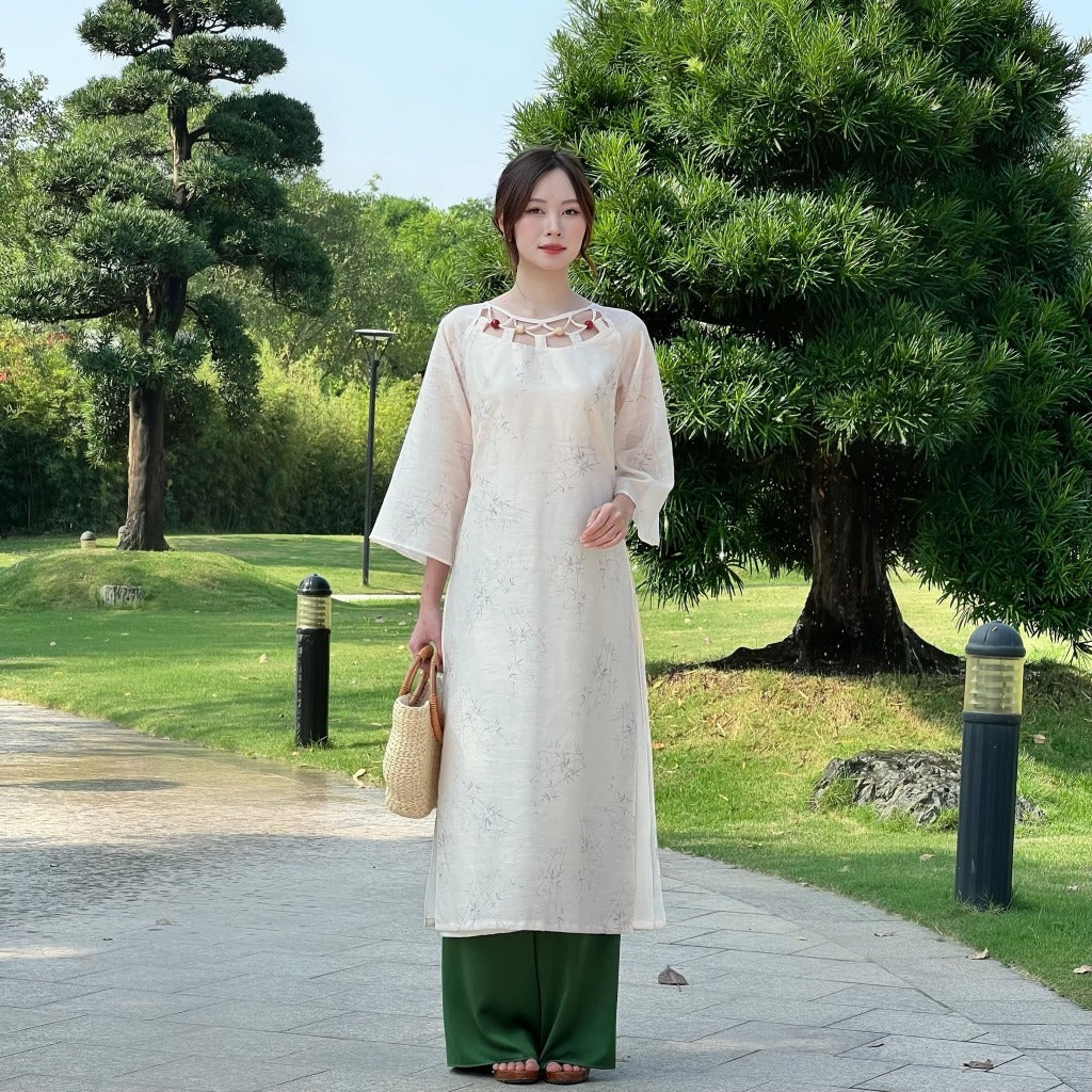 Truc Hong innovative ao dai with bamboo motifs and pearl silk, stylized collar with wooden beads – SD010 LANA DESIGN