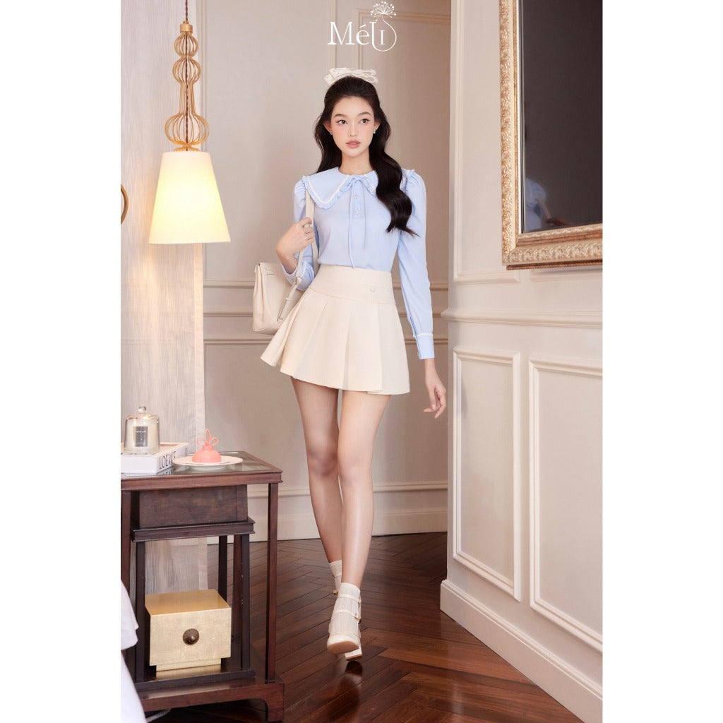 Blue long-sleeved ruffle collar shirt - Cream pleated skirt with cream lace - Méli