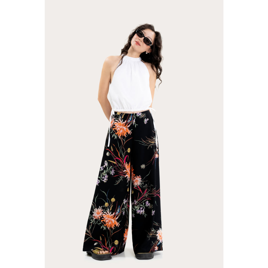 LIBÉ WORKSHOP - Wide leg pants with floral print and black background