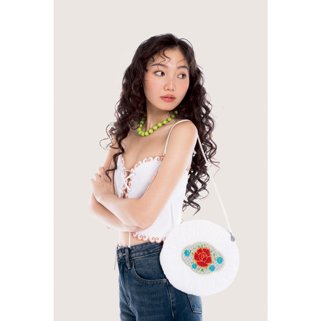 LIBÉ WORKSHOP - Oval shoulder bag with white floral patterned fabric label